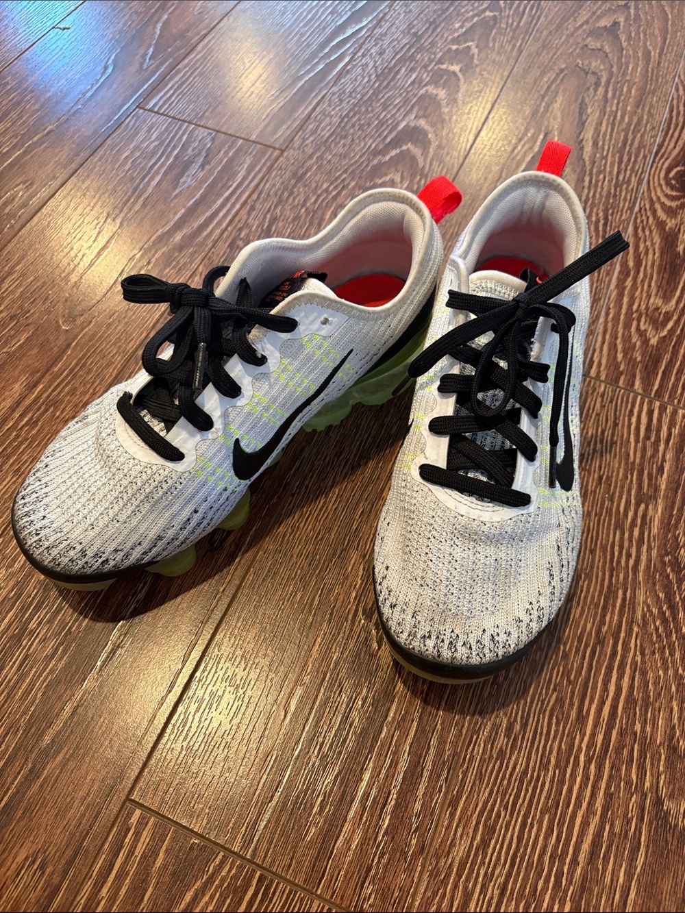 Nike Kids White Knit Sneakers with Black Swoosh and Neon Green Soles